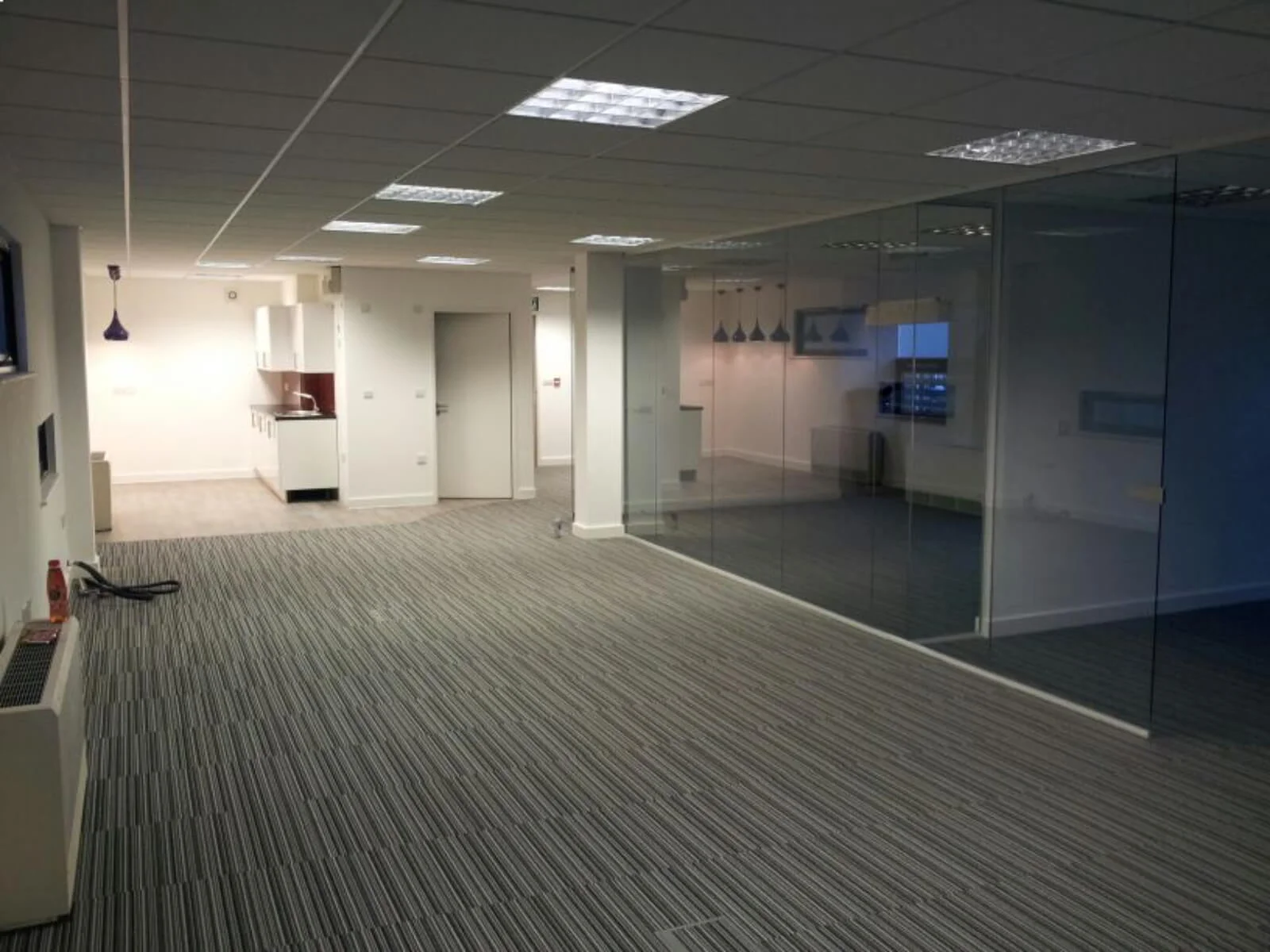 Unimines office space with designer furnitures and laminated wood flooring and suspended grid ceiling and glass partitions screen 26 Unimines office space with designer furnitures and laminated wood flooring and suspended grid ceiling and glass partitions screen 26