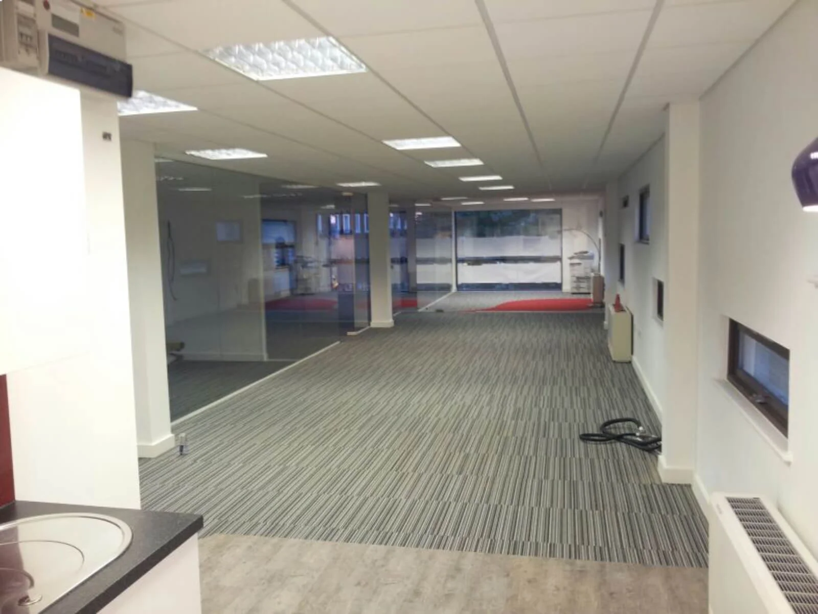 Unimines office space with designer furnitures and laminated wood flooring and suspended grid ceiling and glass partitions screen 30 Unimines office space with designer furnitures and laminated wood flooring and suspended grid ceiling and glass partitions screen 30
