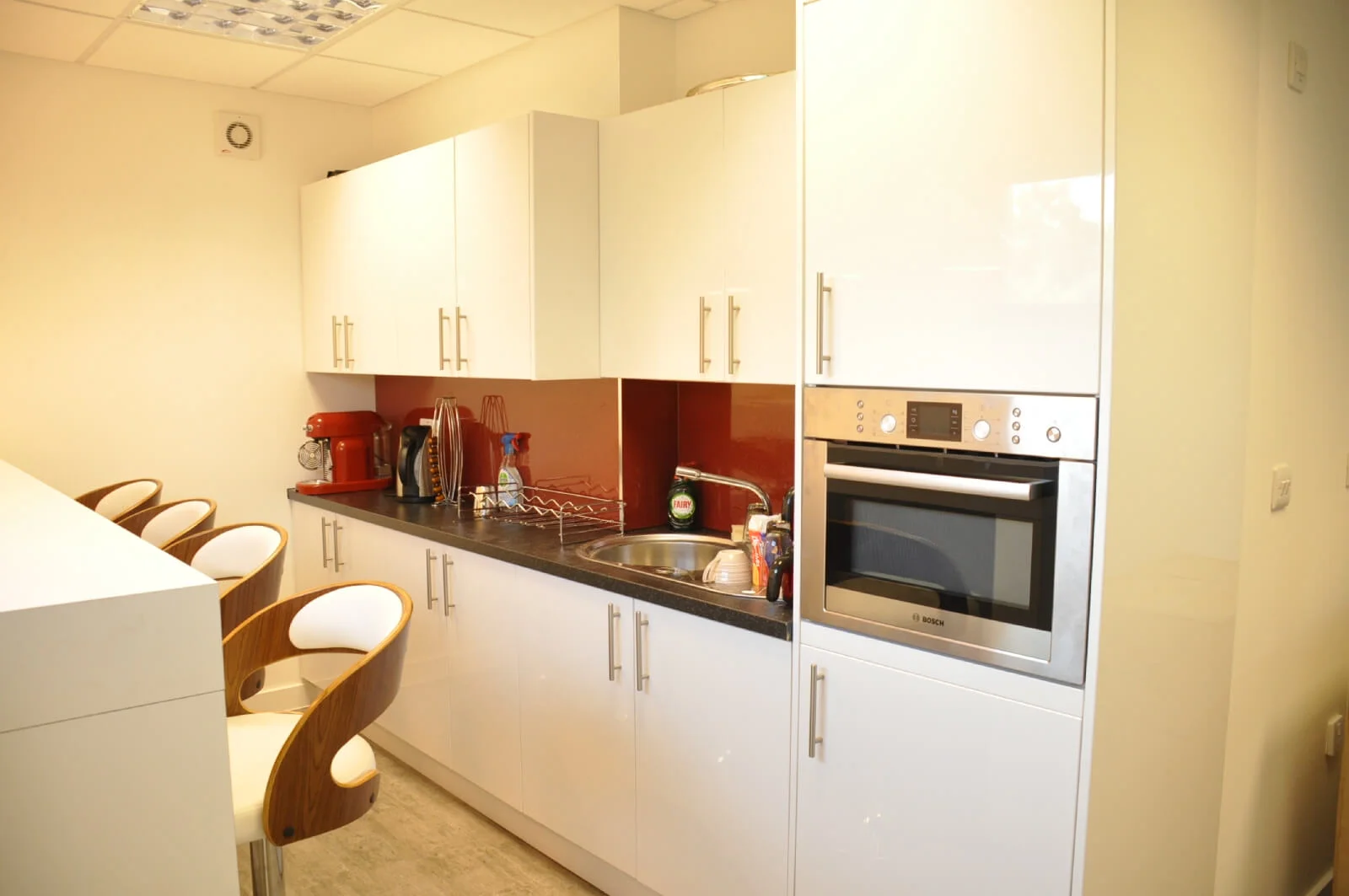 Unimines office space with designer furnitures and laminated wood flooring and suspended grid ceiling and glass partitions screen 5 Unimines office space with designer furnitures and laminated wood flooring and suspended grid ceiling and glass partitions screen 5