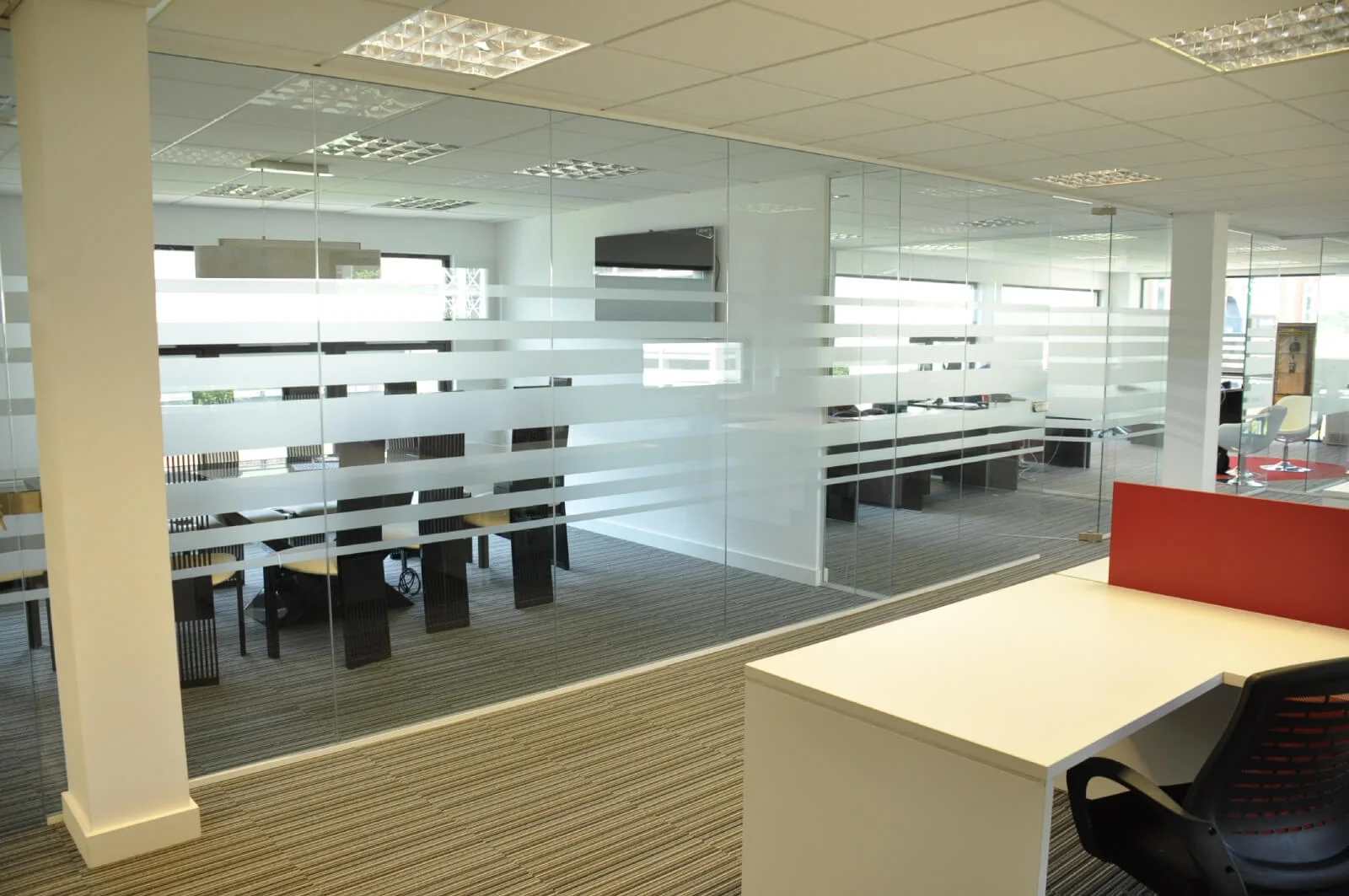 Unimines office space with designer furnitures and laminated wood flooring and suspended grid ceiling and glass partitions screen 8 Unimines office space with designer furnitures and laminated wood flooring and suspended grid ceiling and glass partitions screen 8