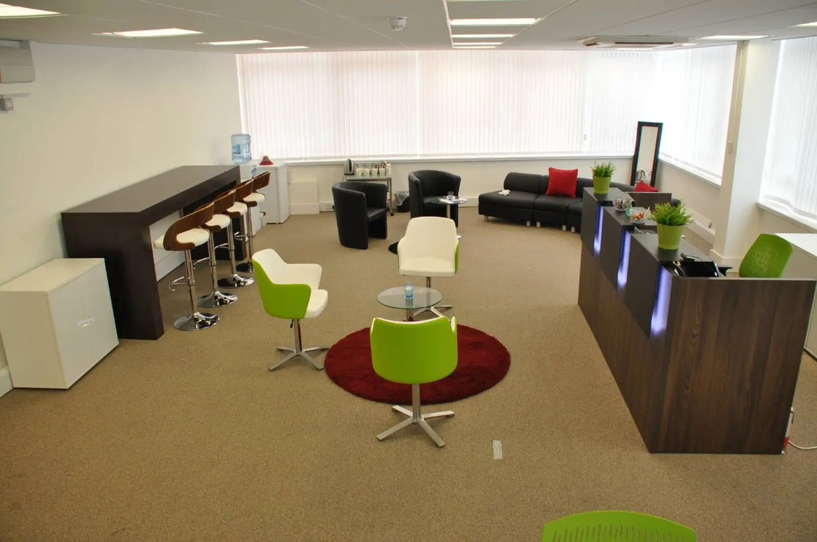 Corinthain House office space design with designer furniture, suspended grid ceiling, carpet tile flooring and glass partitions