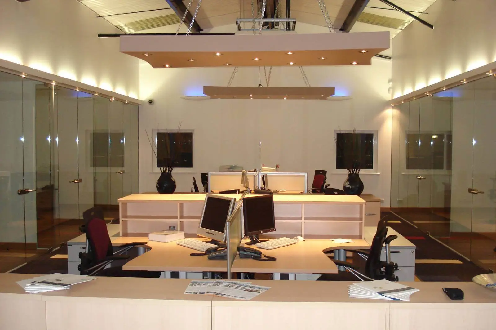 GXI office unit D space design with designer furniture, along with flooring, ceiling, and glass partitions