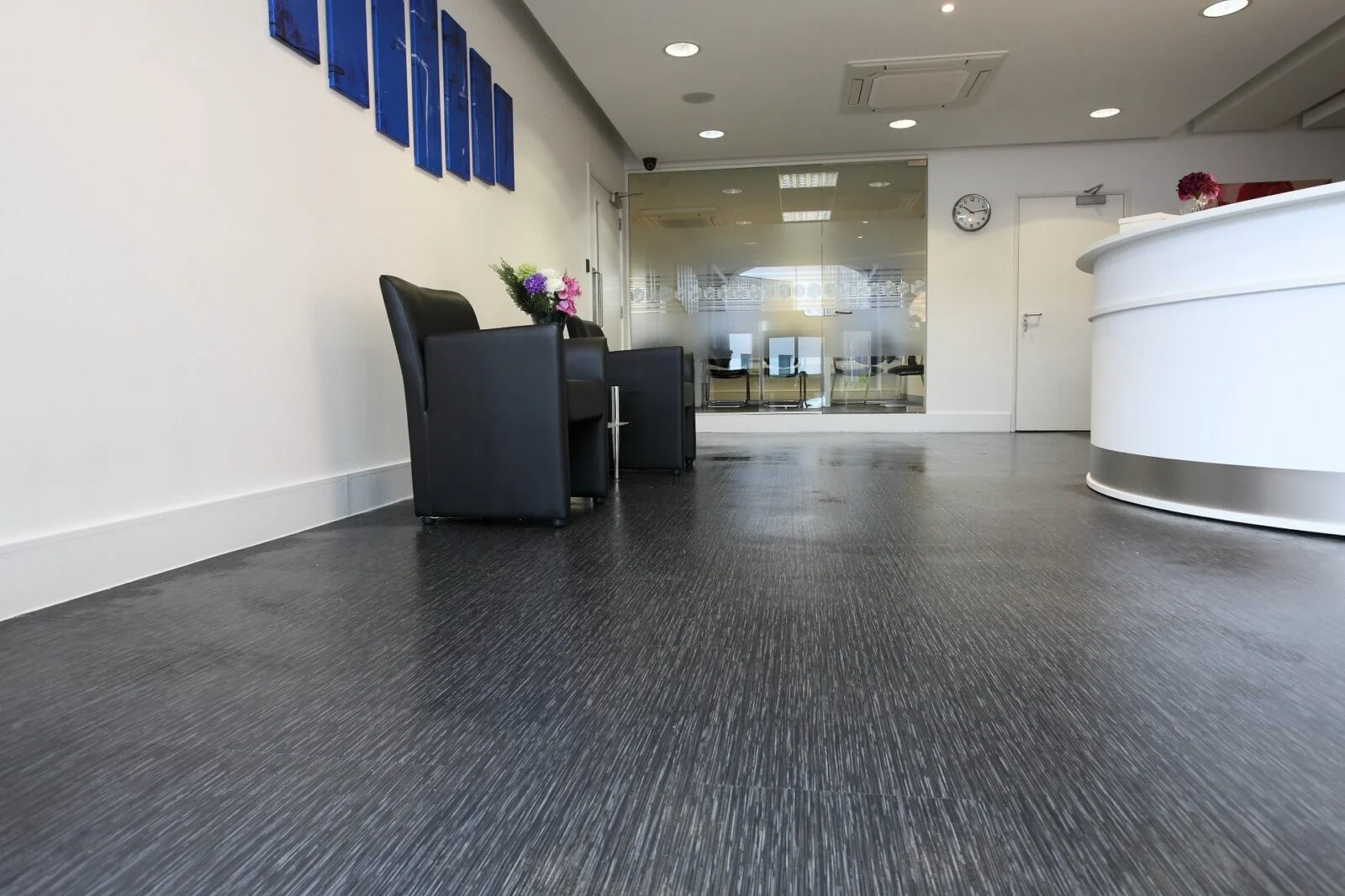 Tempus court office space with designer furnitures and designer flooring and suspended grid ceiling and glass partitions screen