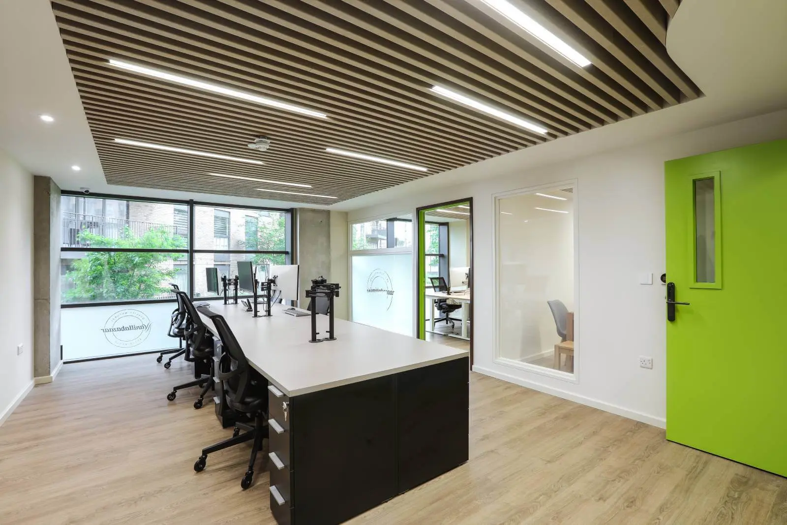 Vanilla Bazaar office space with designer furniture, laminated wood flooring, ceiling and glass partitions