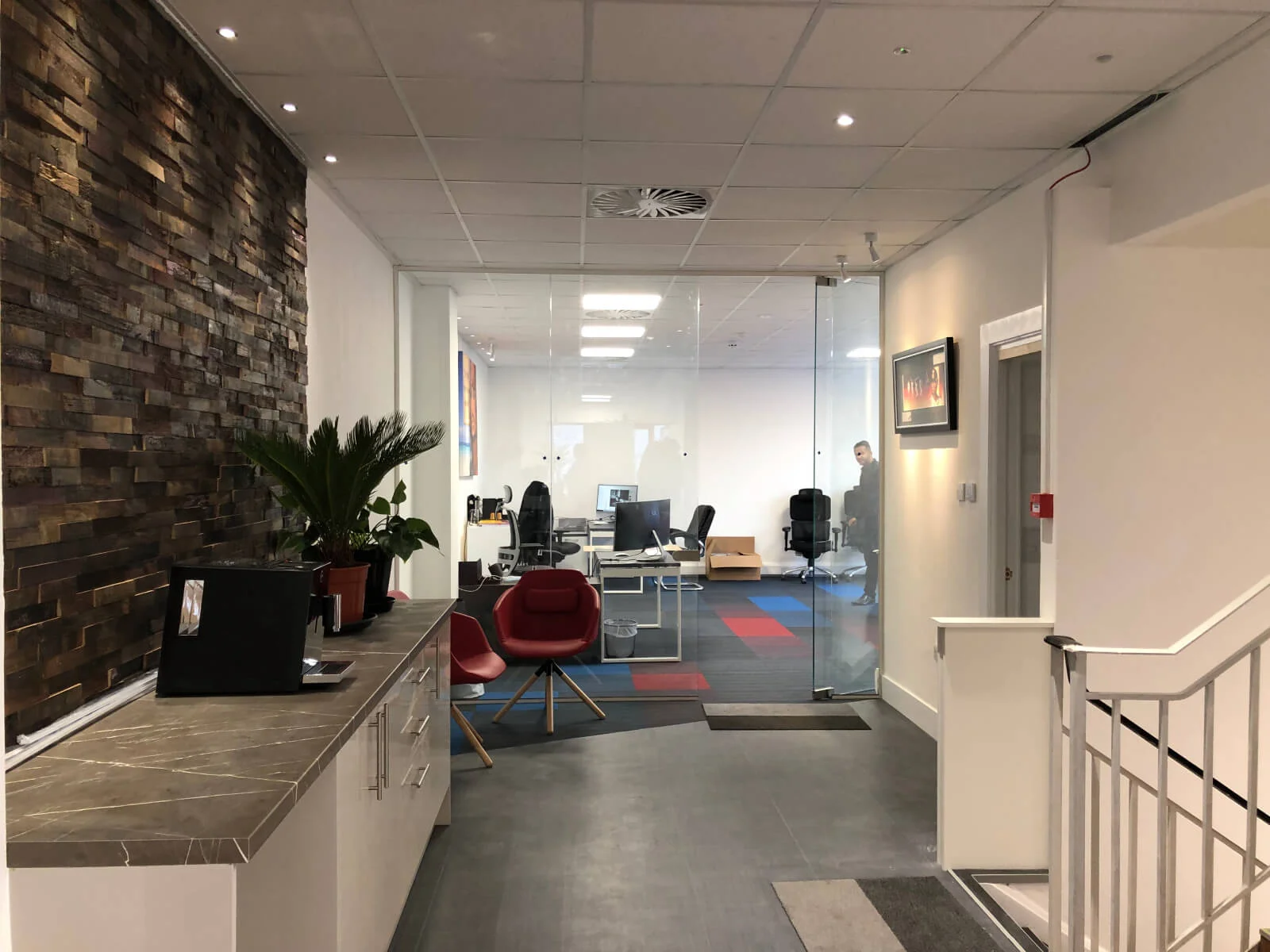 veswas office space with designer furnitures and raised flooring and suspended grid ceiling and glass partitions screen