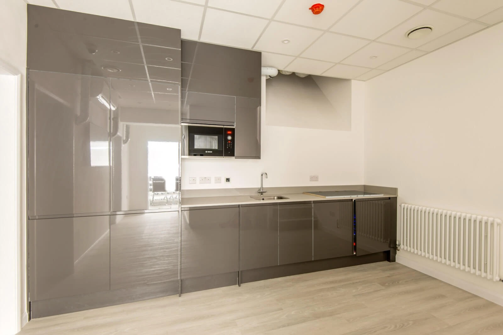 Able Prop office design with designer back to back desks with screens and chairs 1