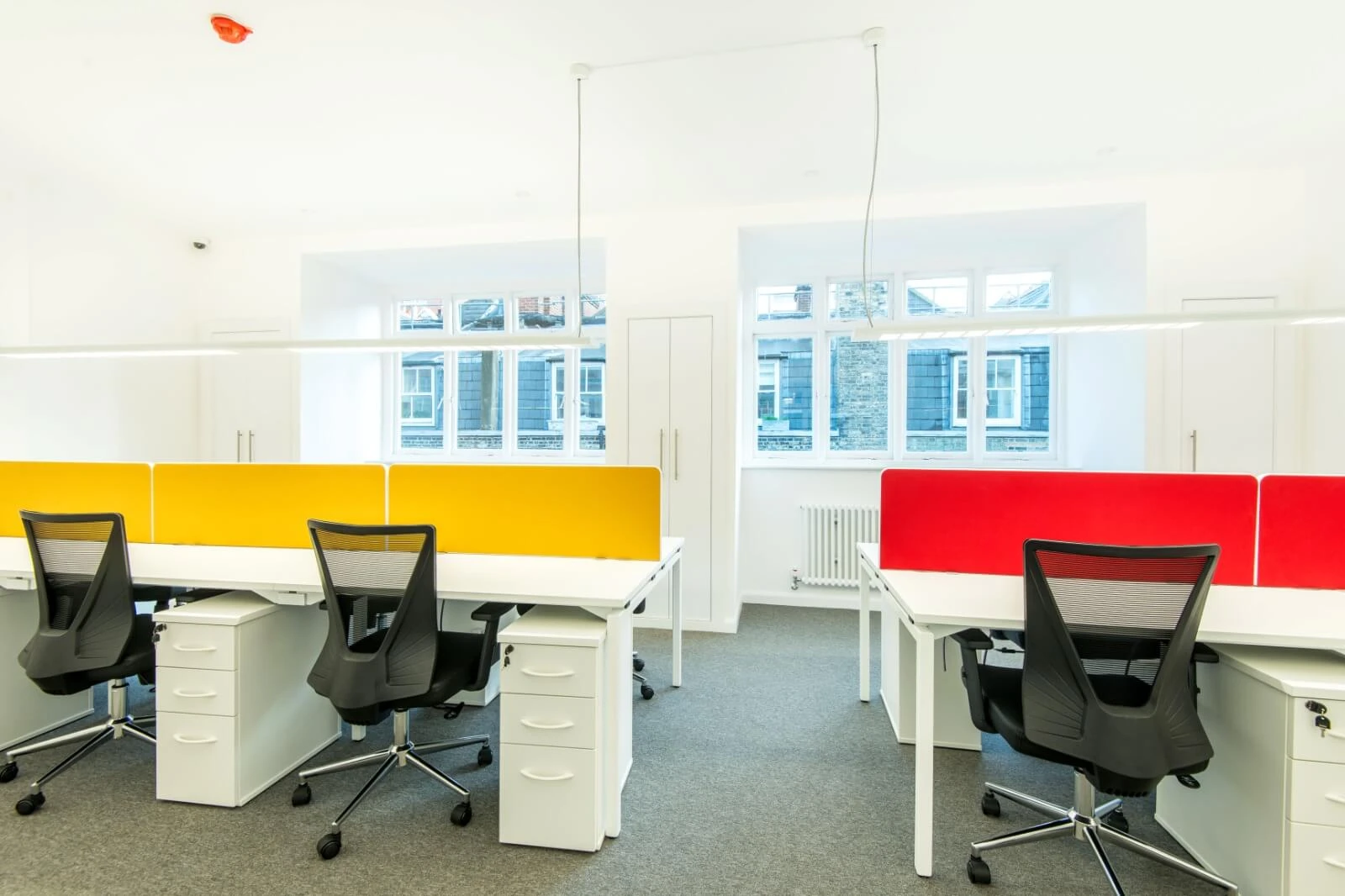 Able Prop office design with designer back to back desks with screens and chairs 10