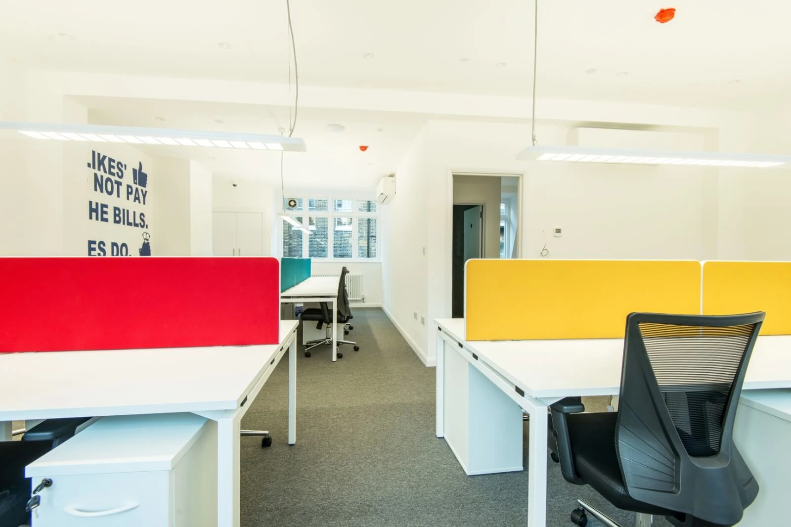 Able Prop office design with designer back to back desks with screens and chairs 15