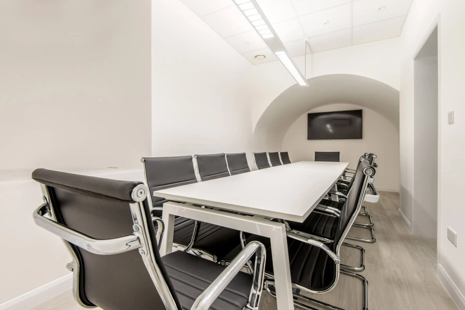 Able Prop office design with designer back to back desks with screens and chairs 16