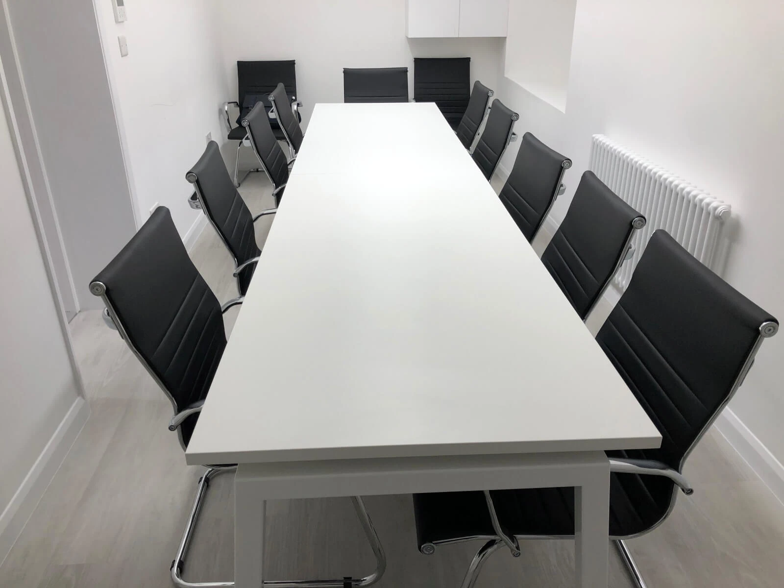 Able Prop office design with designer back to back desks with screens and chairs 4