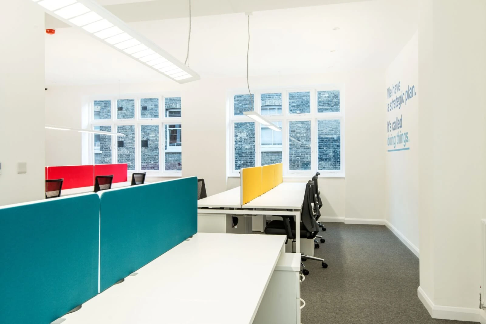 Able Prop office design with designer back to back desks with screens and chairs 9