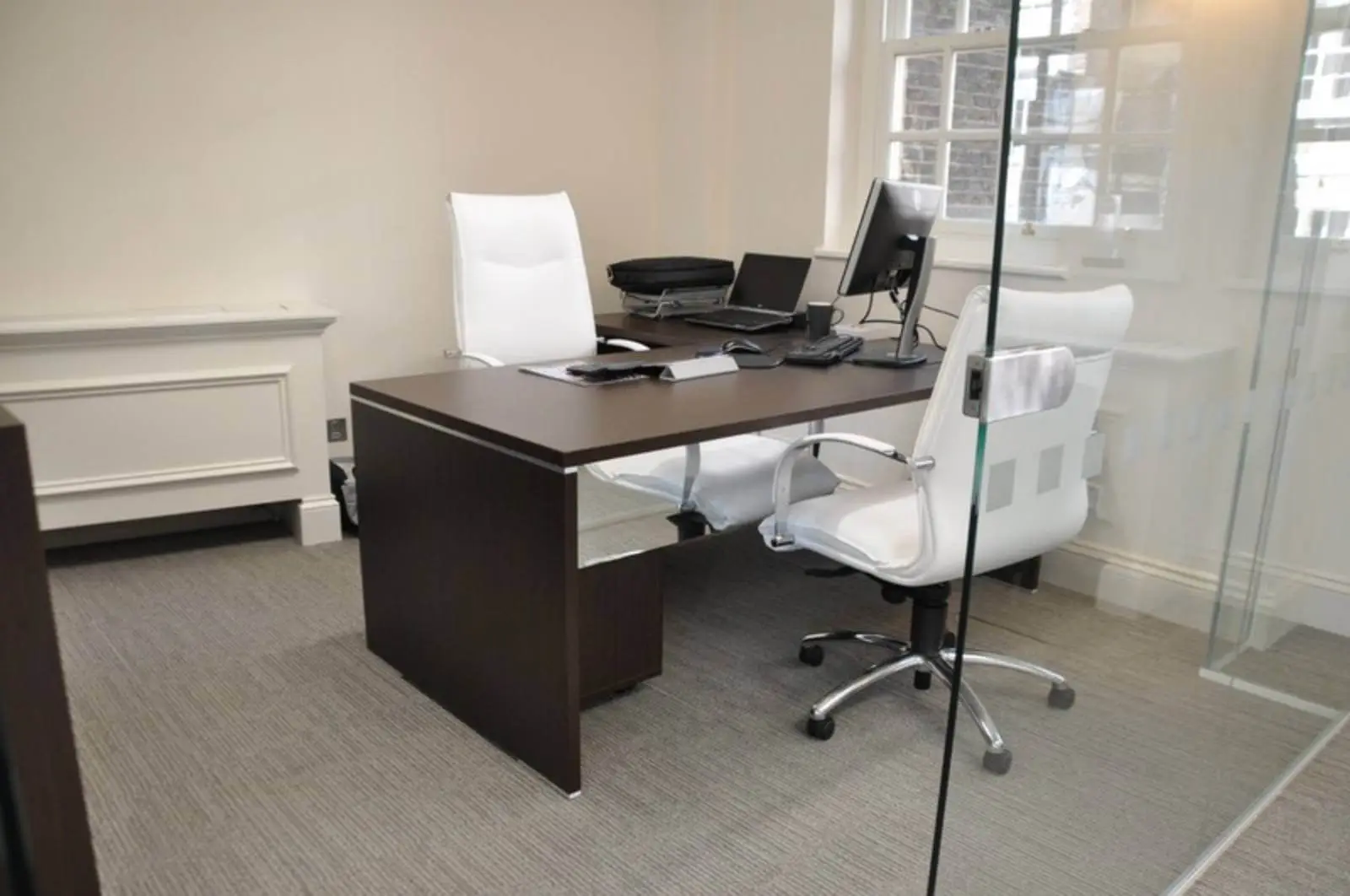 Aprirose-office-space-with-designer-furniture,-plasterboard-ceiling,-laminated-wood-flooring-and-glass-partitions 1