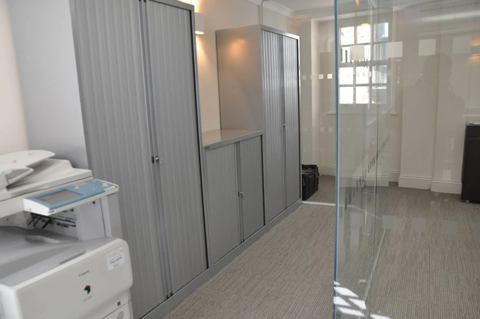 Aprirose-office-space-with-designer-furniture,-plasterboard-ceiling,-laminated-wood-flooring-and-glass-partitions 10