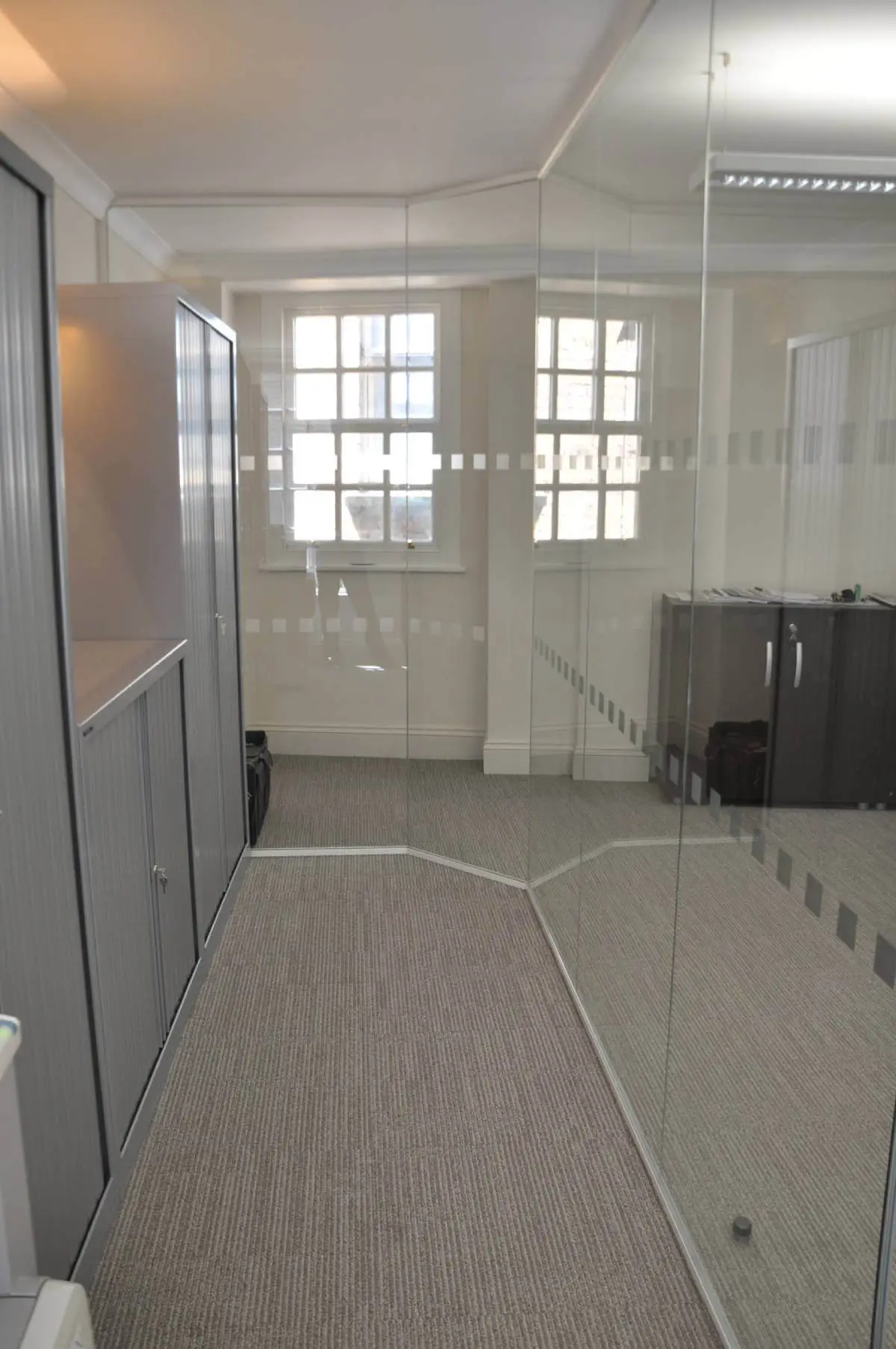 Aprirose-office-space-with-designer-furniture,-plasterboard-ceiling,-laminated-wood-flooring-and-glass-partitions 11