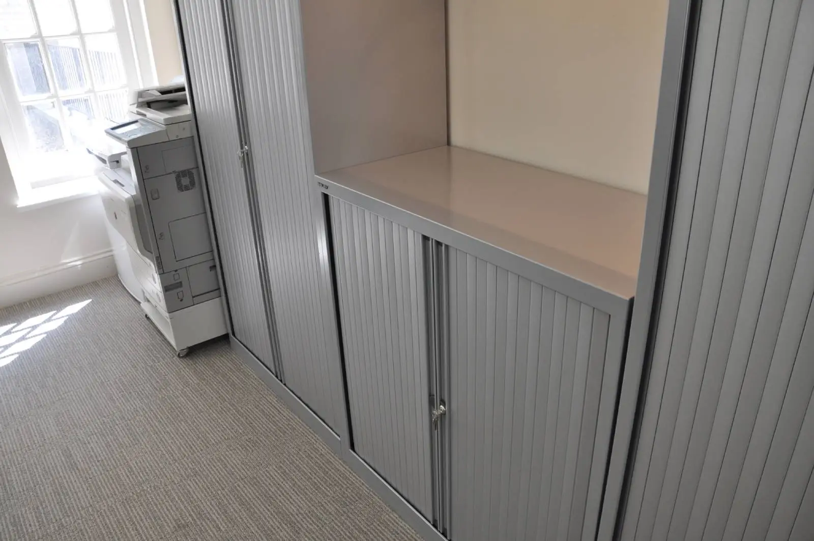 Aprirose-office-space-with-designer-furniture,-plasterboard-ceiling,-laminated-wood-flooring-and-glass-partitions 13
