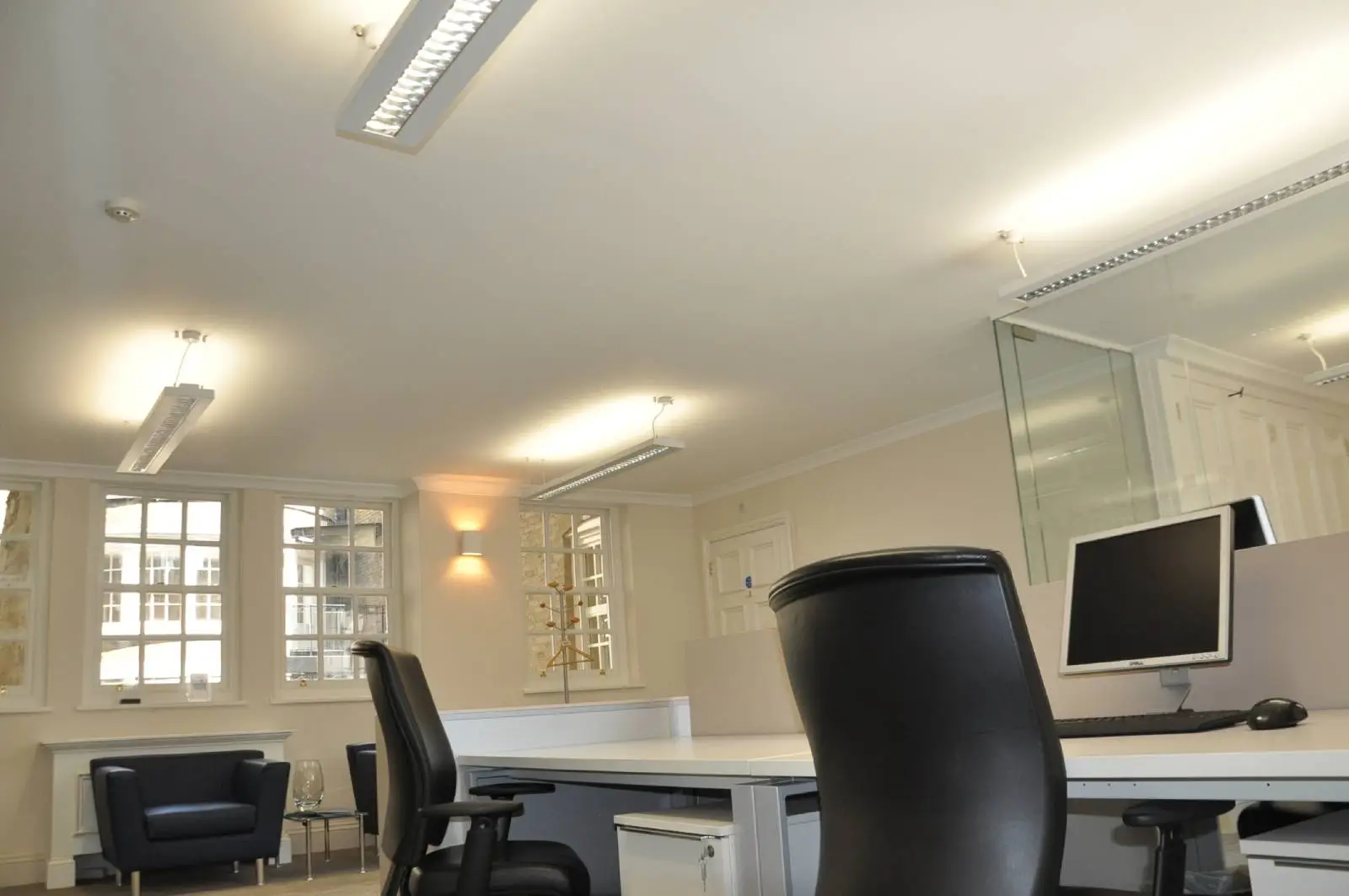 Aprirose-office-space-with-designer-furniture,-plasterboard-ceiling,-laminated-wood-flooring-and-glass-partitions 25