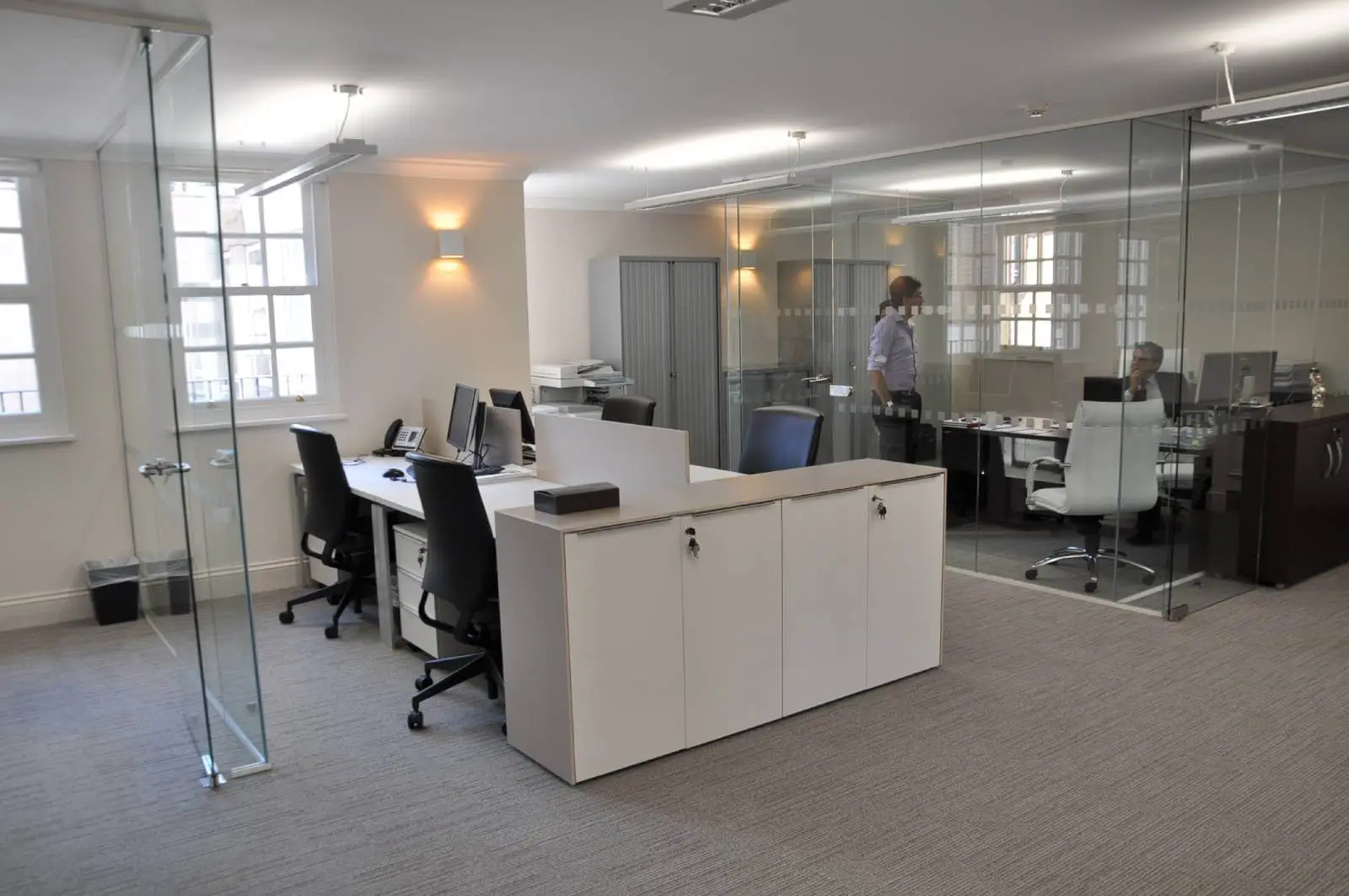 Aprirose-office-space-with-designer-furniture,-plasterboard-ceiling,-laminated-wood-flooring-and-glass-partitions 3