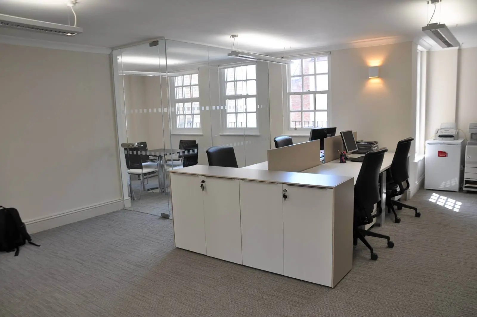 Aprirose-office-space-with-designer-furniture,-plasterboard-ceiling,-laminated-wood-flooring-and-glass-partitions 7