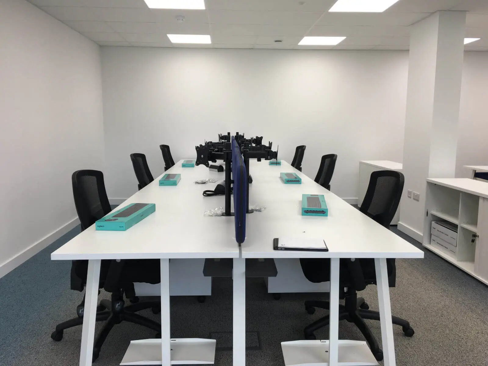Beat Concept office space with designer back to back office desks, chiars and suspended grid ceiling 13