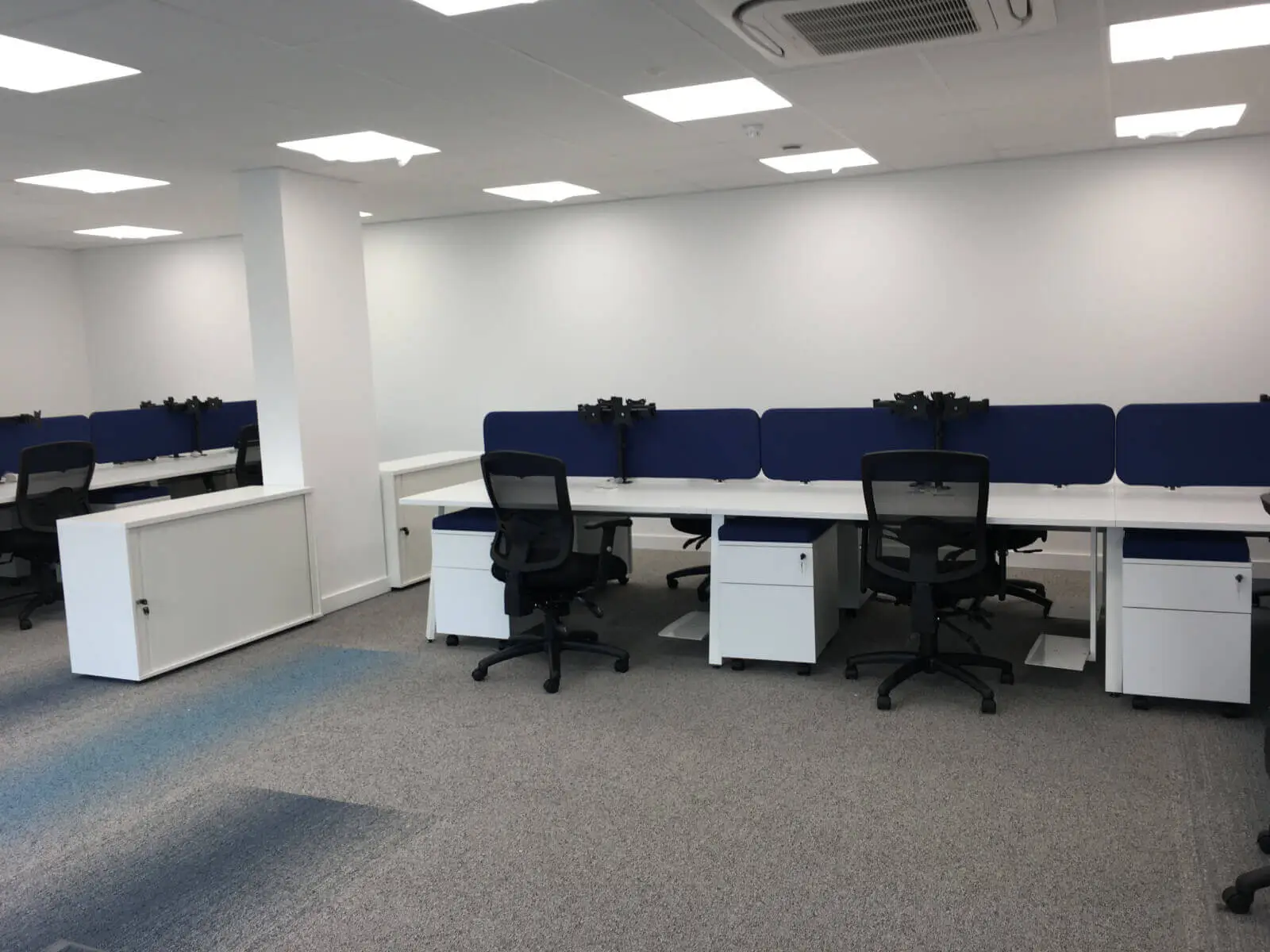 Beat Concept office space with designer back to back office desks, chiars and suspended grid ceiling 4