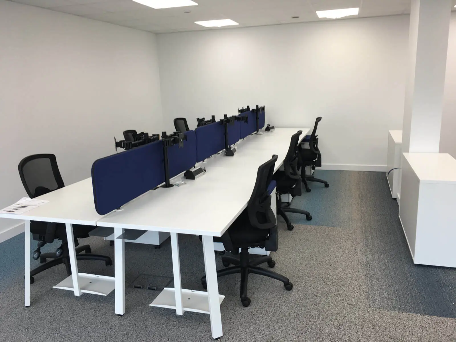 Beat Concept office space with designer back to back office desks, chiars and suspended grid ceiling 5