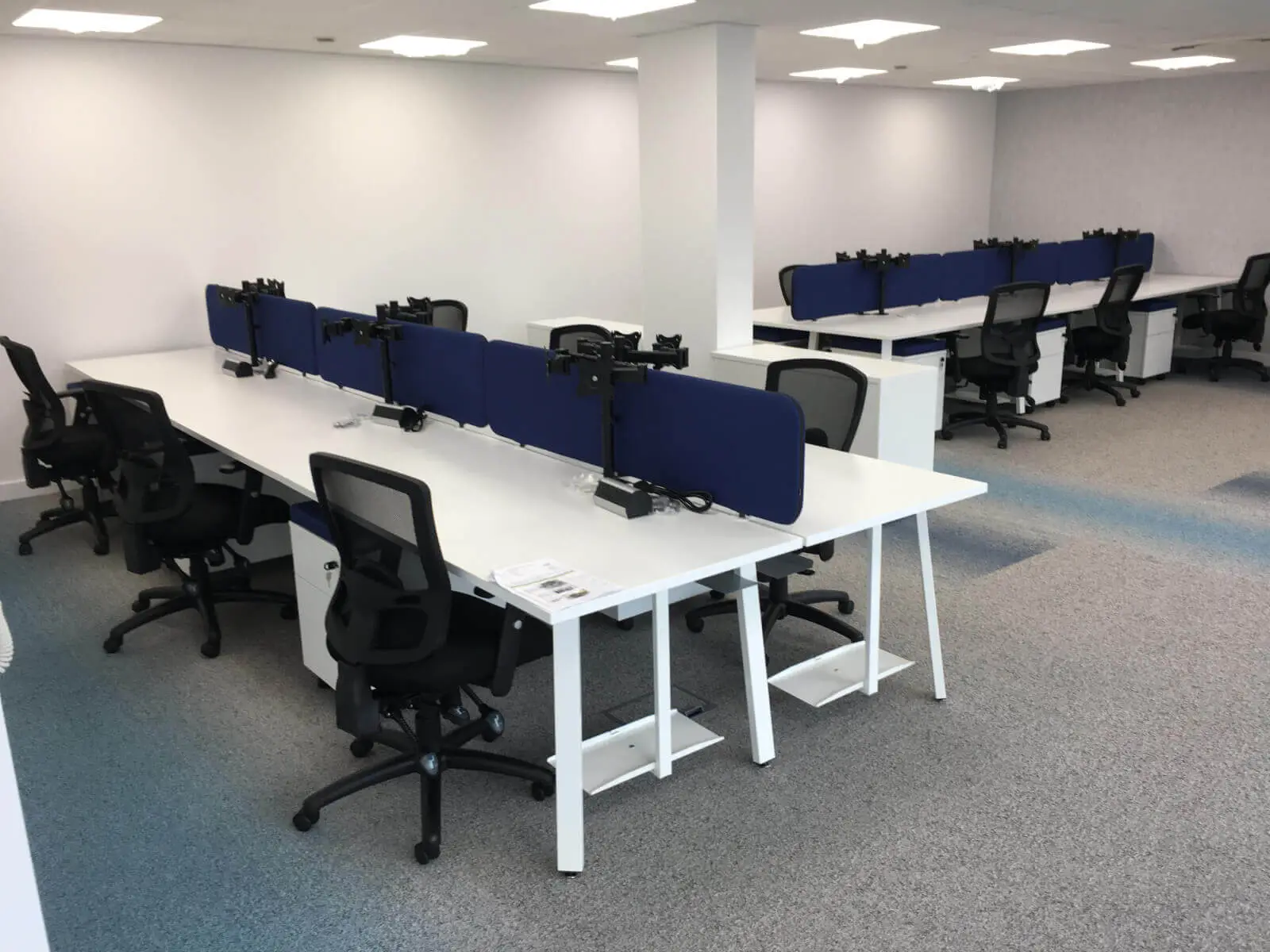 Beat Concept office space with designer back to back office desks, chiars and suspended grid ceiling 6