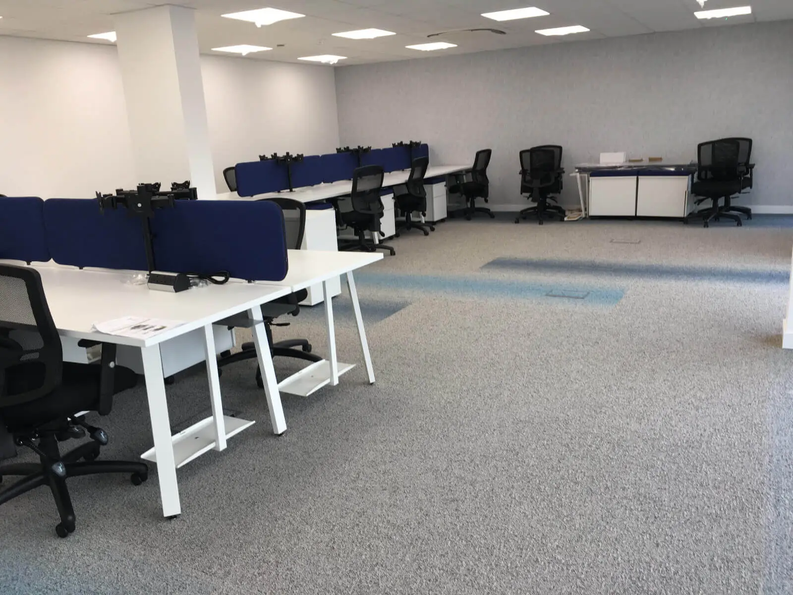 Beat Concept office space with designer back to back office desks, chiars and suspended grid ceiling 7