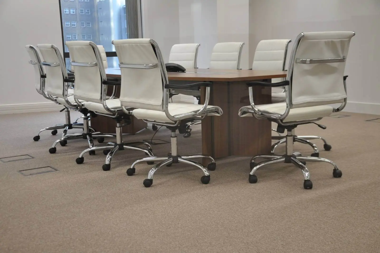 Bordeux office space with designer furniture, laminated wood floor, suspended grid ceiling, and glass partitions 21