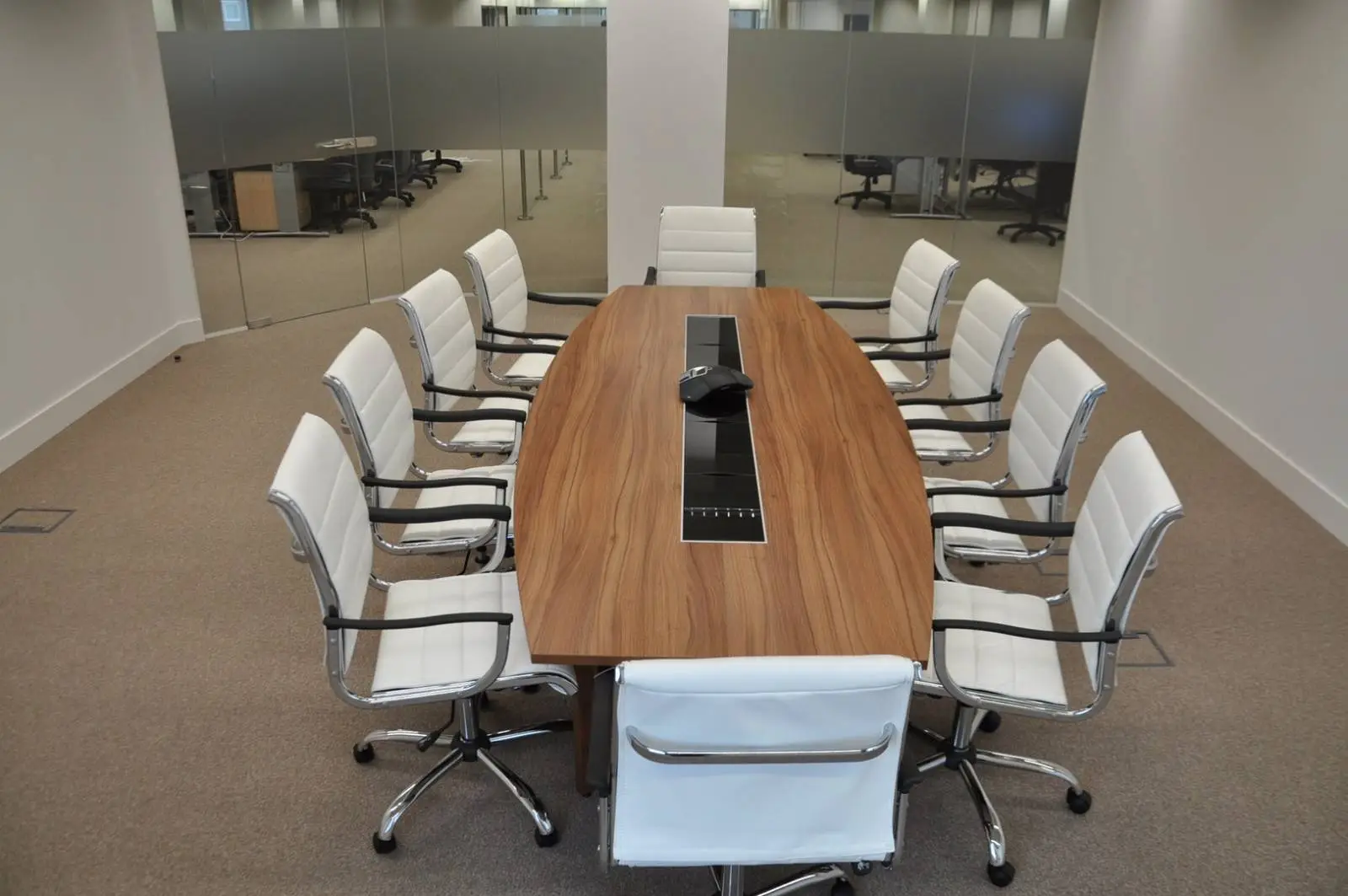 Bordeux office space with designer furniture, laminated wood floor, suspended grid ceiling, and glass partitions 3