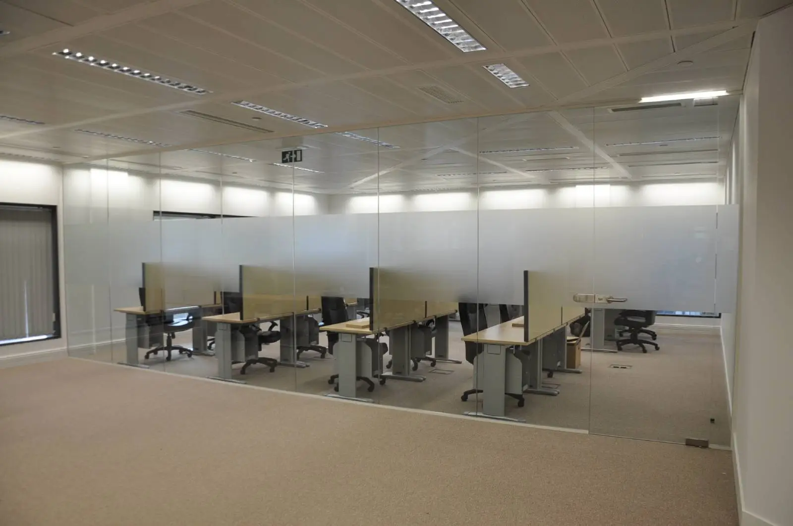 Bordeux office space with designer furniture, laminated wood floor, suspended grid ceiling, and glass partitions 9