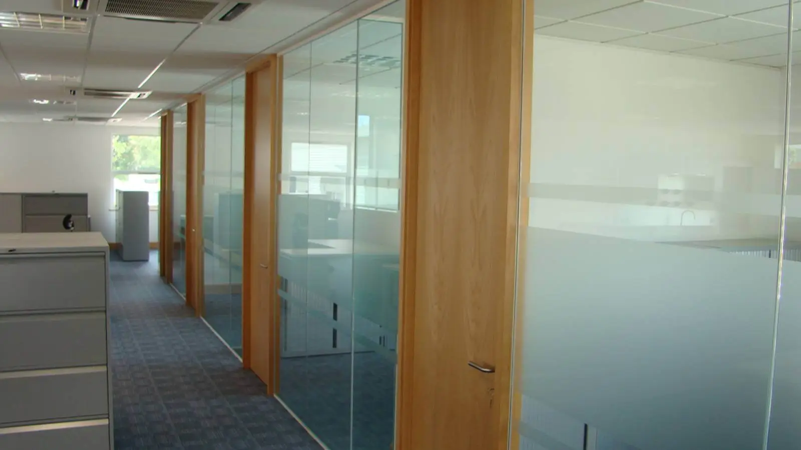Brightstone Law firm with designer furniture, suspended grid ceiling, carpet tile flooring and glass partitions 3