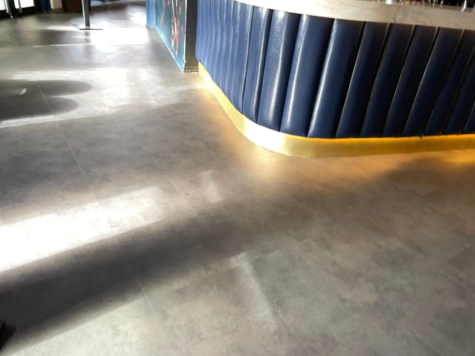 Cardamom Bar and Club with designer high tables, chairs, carpet tile flooring, and led lightings 10