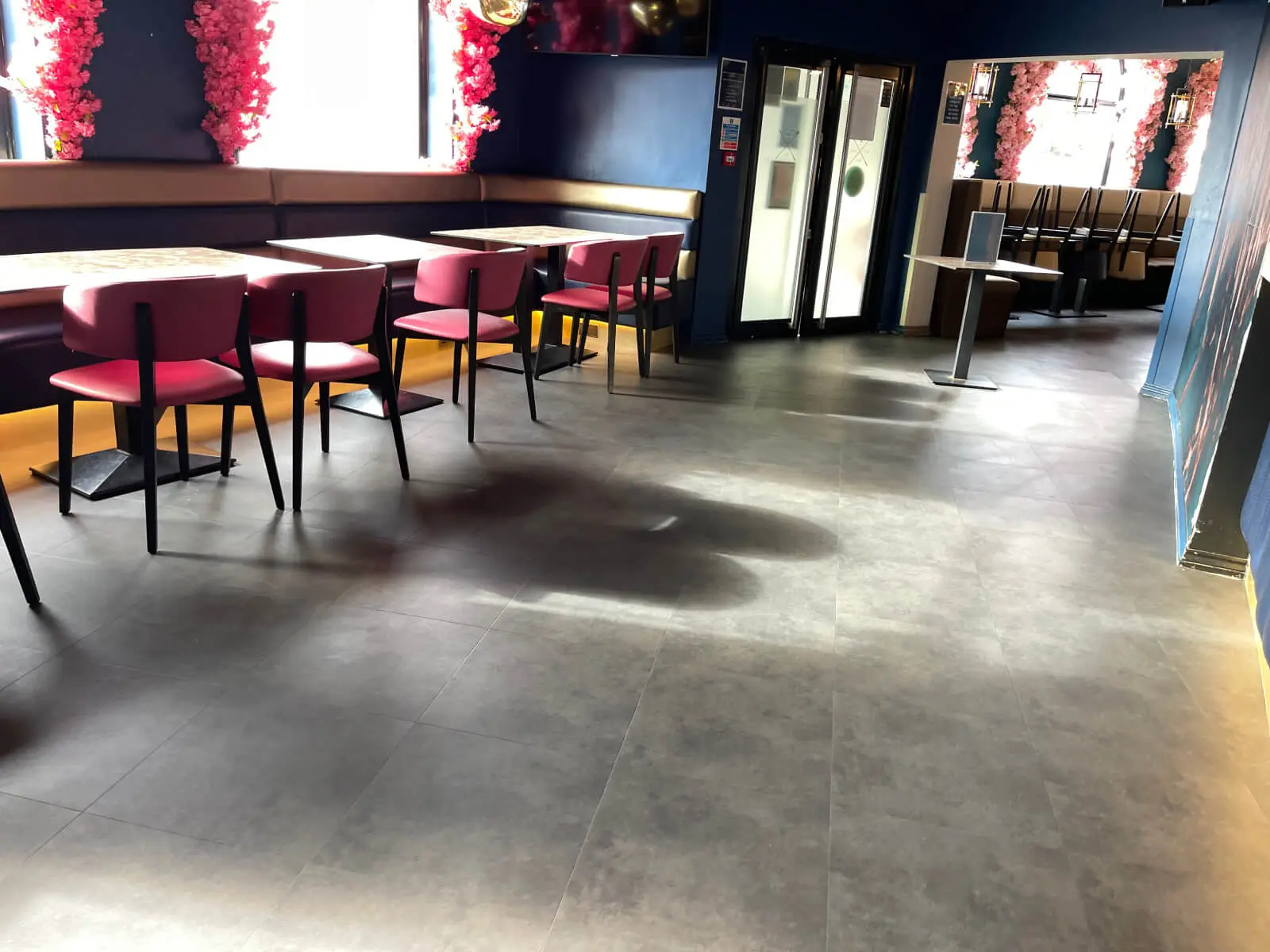 Cardamom Bar and Club with designer high tables, chairs, carpet tile flooring, and led lightings 11