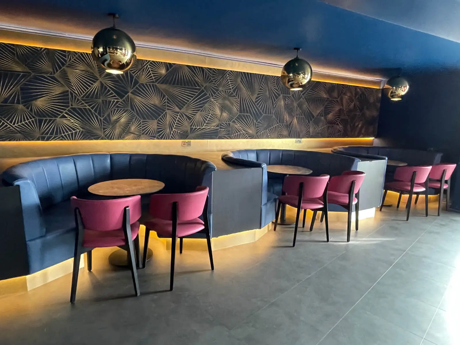Cardamom Bar and Club with designer high tables, chairs, carpet tile flooring, and led lightings 12