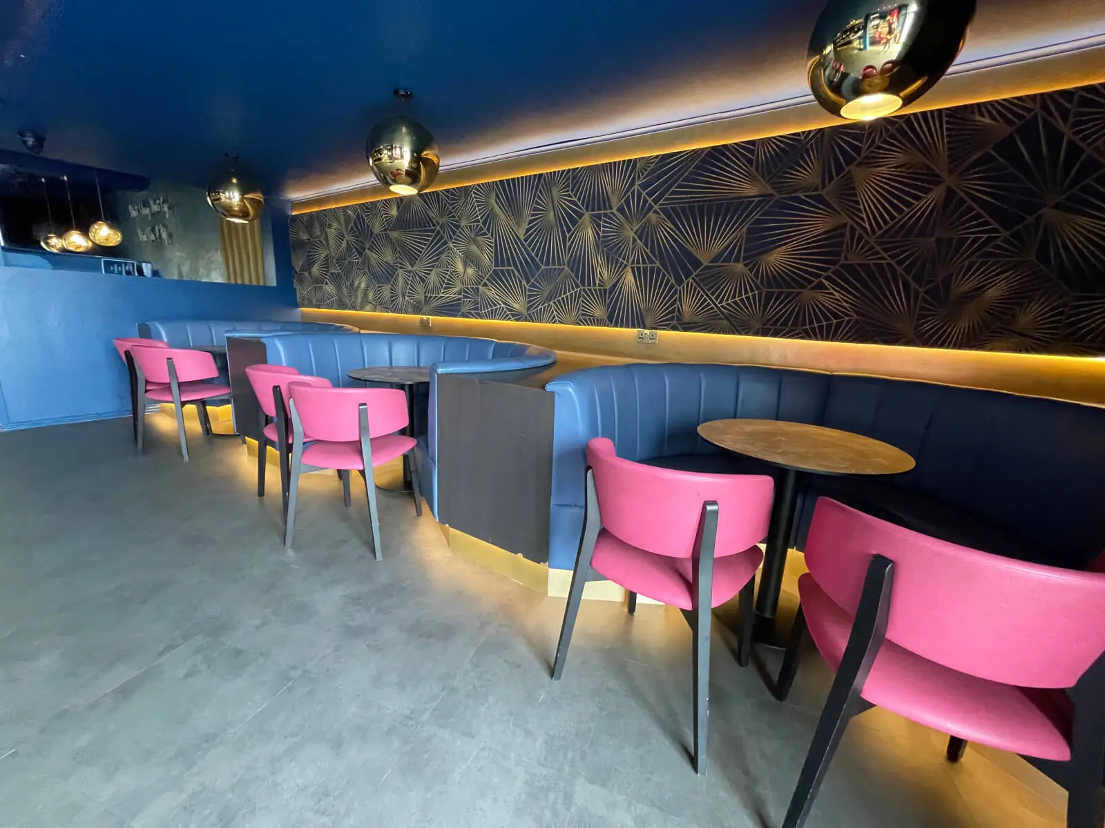 Cardamom Bar and Club with designer high tables, chairs, carpet tile flooring, and led lightings 14