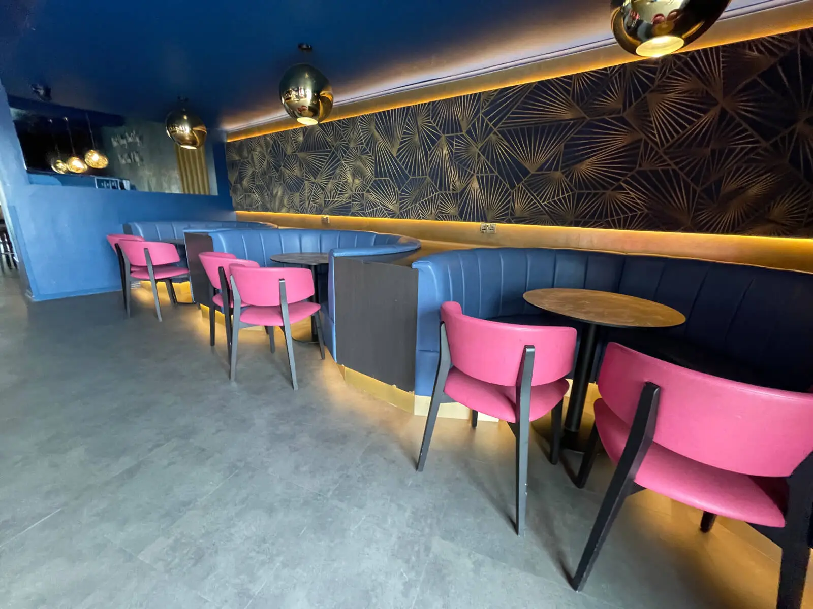 Cardamom Bar and Club with designer high tables, chairs, carpet tile flooring, and led lightings 15