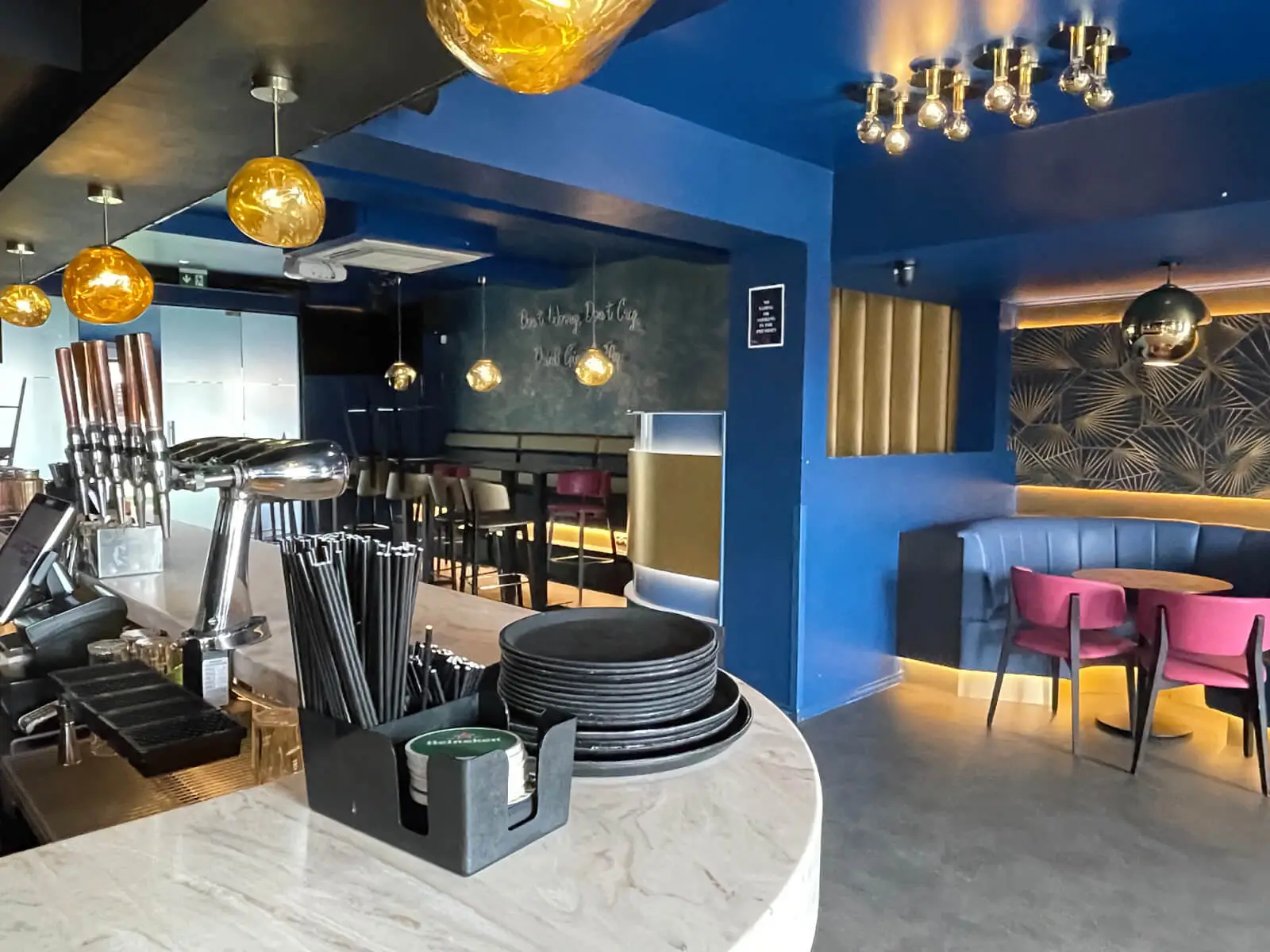 Cardamom Bar and Club with designer high tables, chairs, carpet tile flooring, and led lightings 18