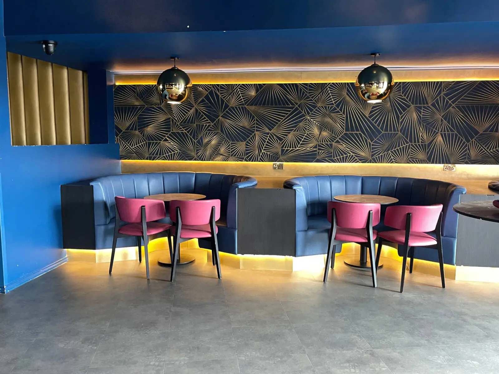 Cardamom Bar and Club with designer high tables, chairs, carpet tile flooring, and led lightings 19