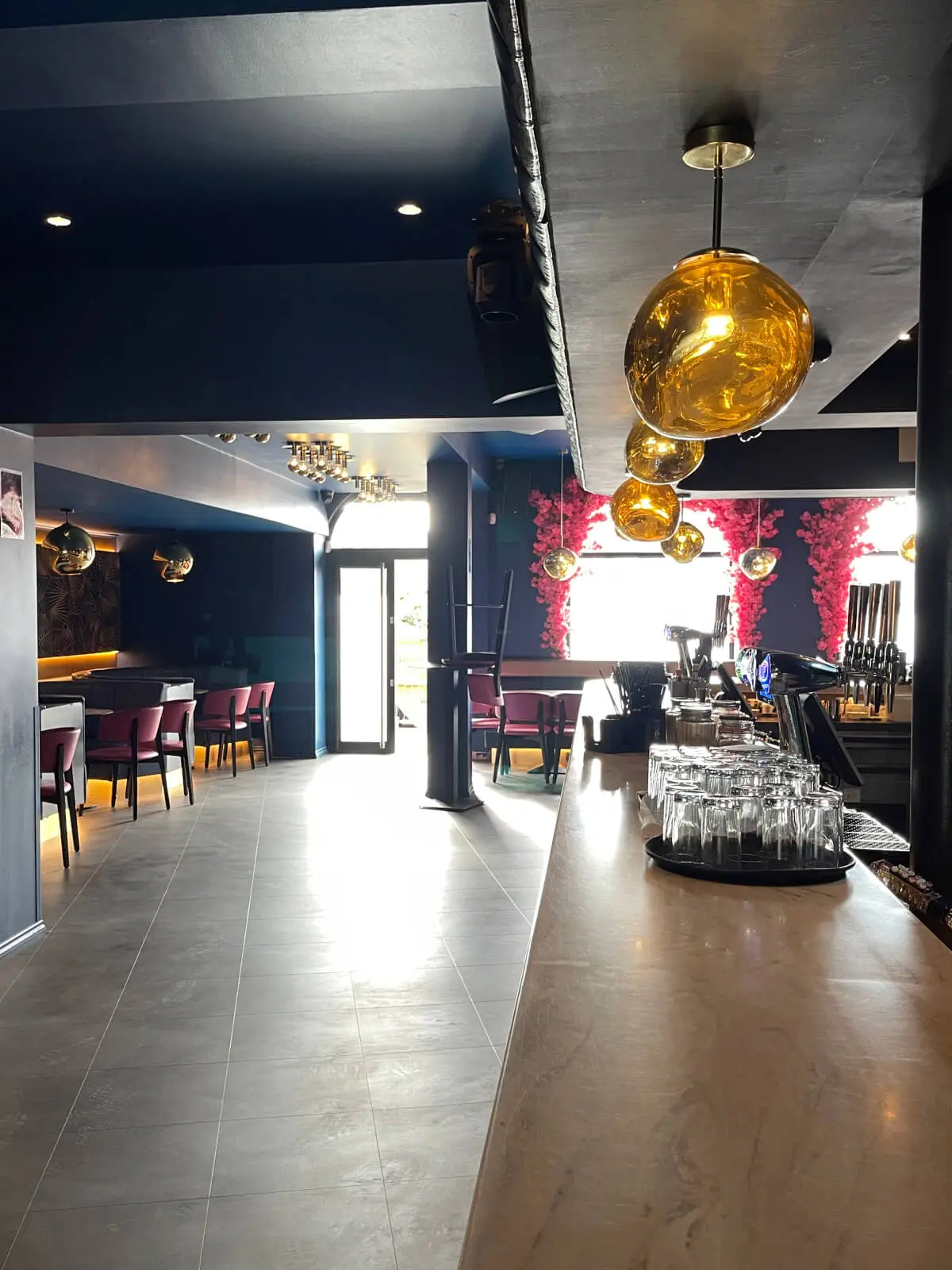 Cardamom Bar and Club with designer high tables, chairs, carpet tile flooring, and led lightings 20