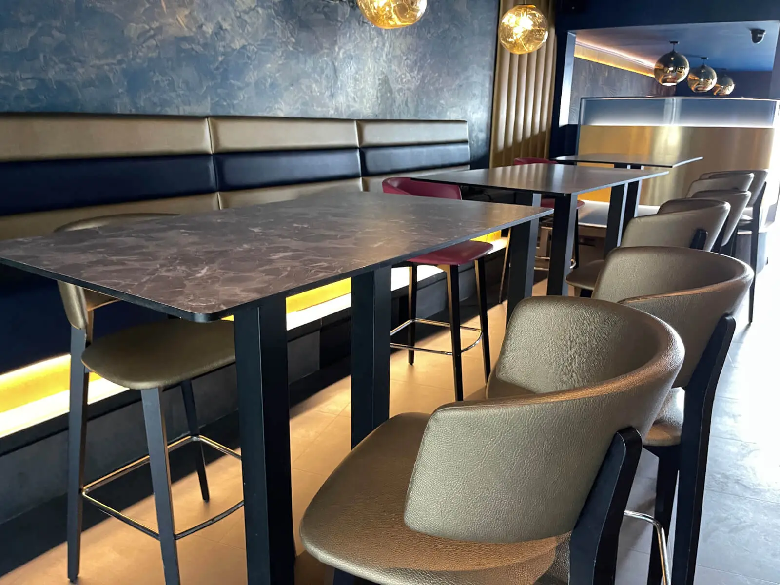Cardamom Bar and Club with designer high tables, chairs, carpet tile flooring, and led lightings 21