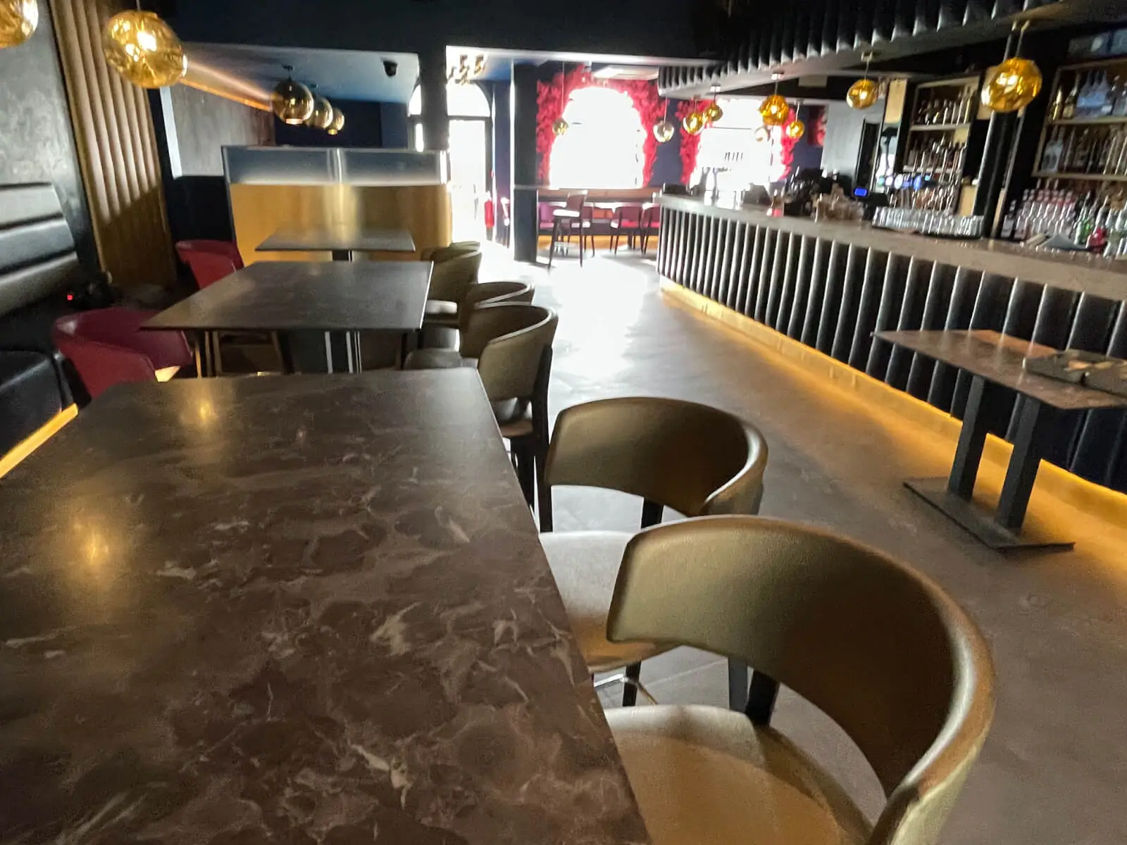 Cardamom Bar and Club with designer high tables, chairs, carpet tile flooring, and led lightings 23