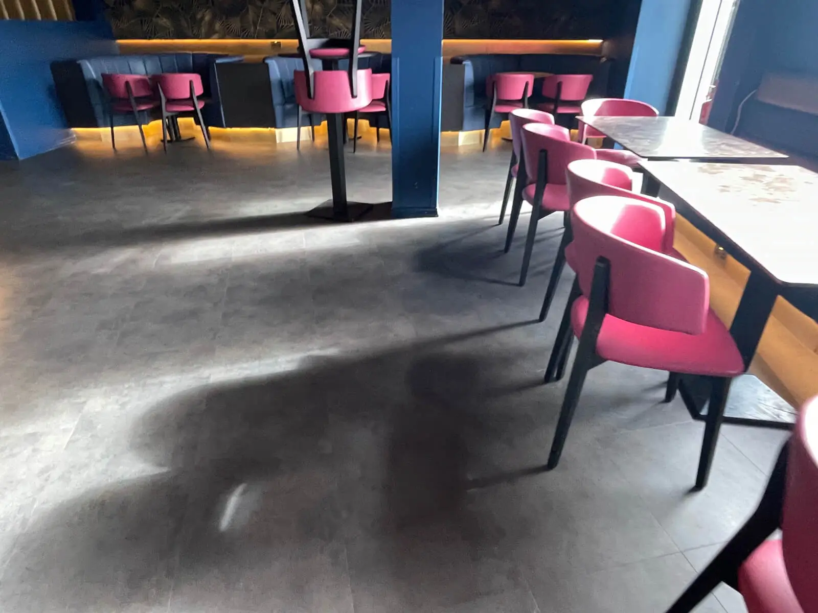 Cardamom Bar and Club with designer high tables, chairs, carpet tile flooring, and led lightings 3