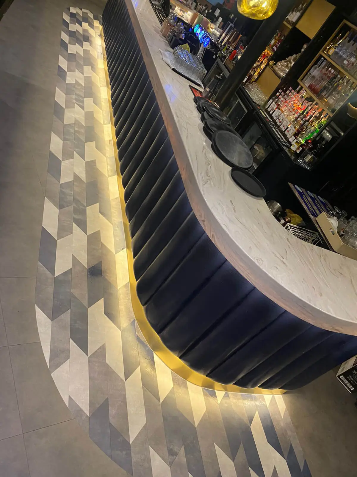 Cardamom Bar and Club with designer high tables, chairs, carpet tile flooring, and led lightings 30