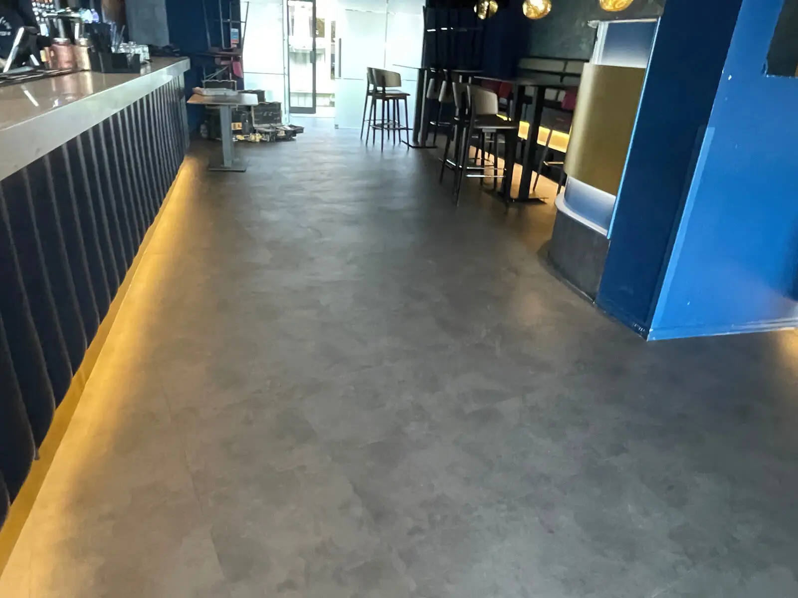 Cardamom Bar and Club with designer high tables, chairs, carpet tile flooring, and led lightings 4