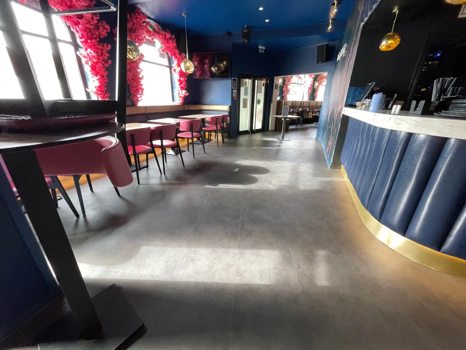 Cardamom Bar and Club with designer high tables, chairs, carpet tile flooring, and led lightings 6