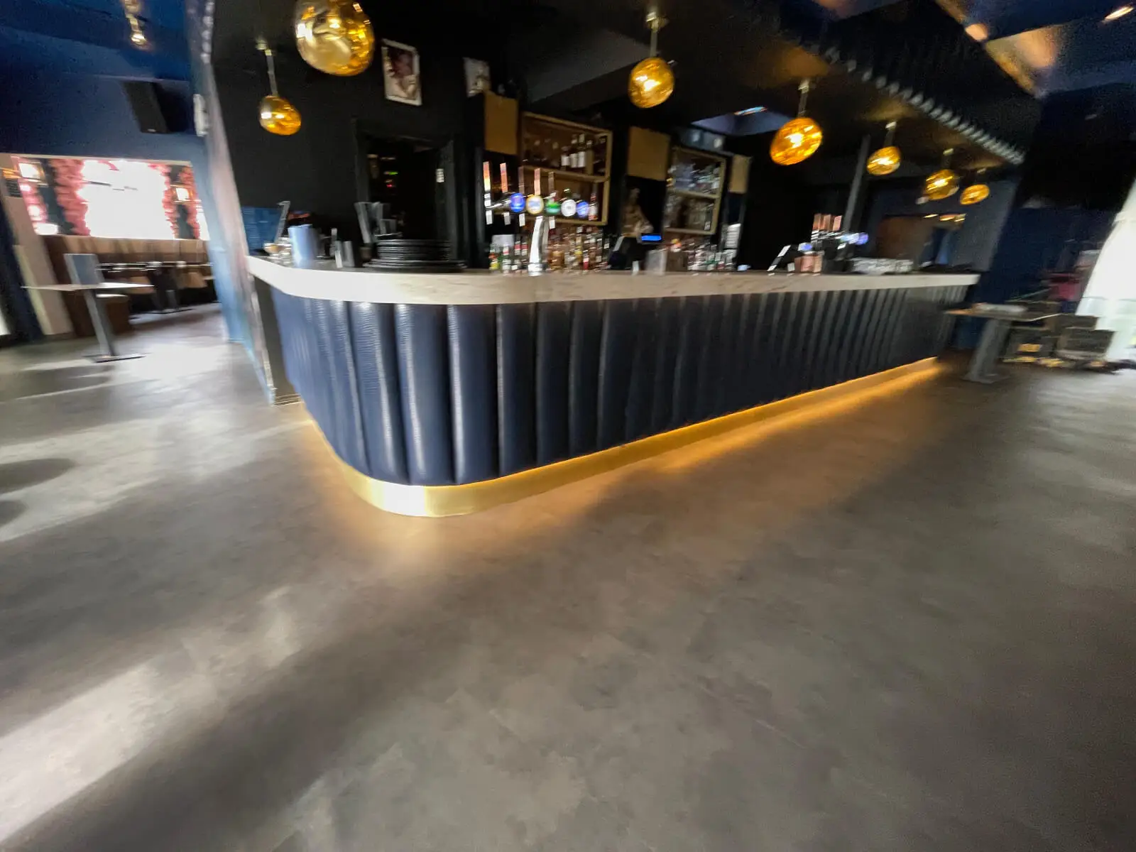 Cardamom Bar and Club with designer high tables, chairs, carpet tile flooring, and led lightings 7