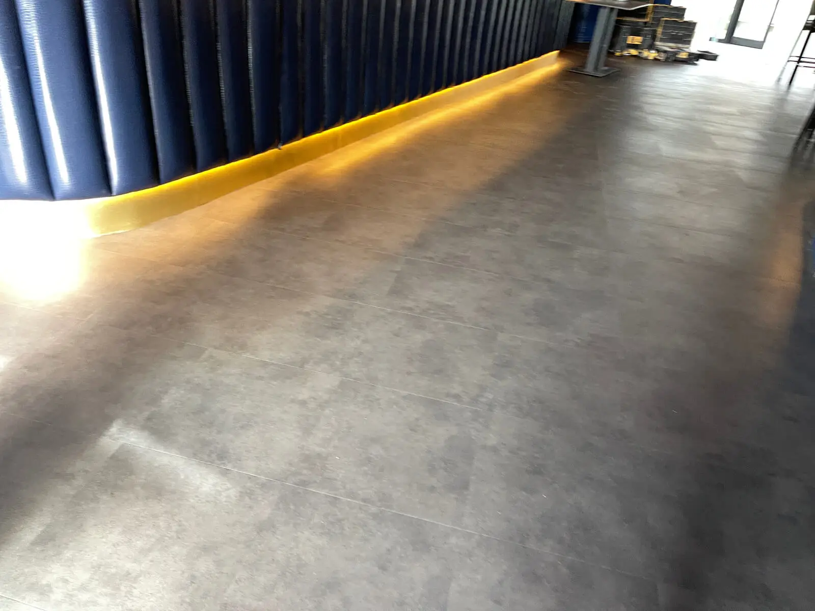 Cardamom Bar and Club with designer high tables, chairs, carpet tile flooring, and led lightings 9