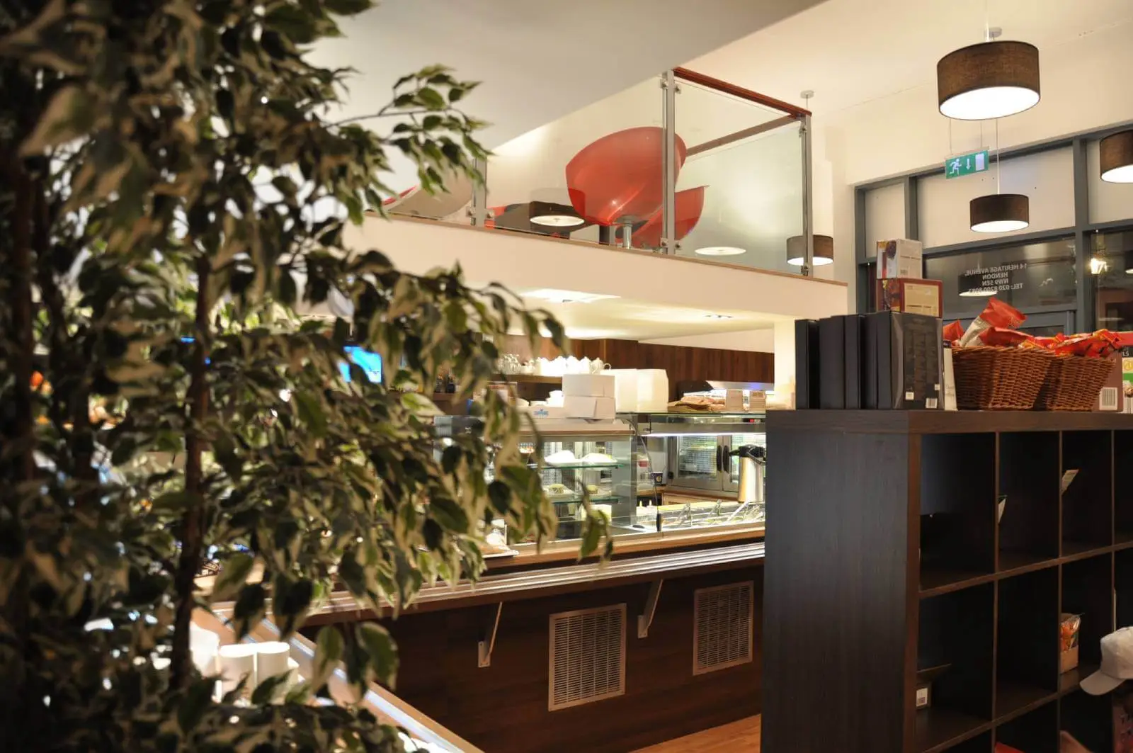 Vanilla Bazaar office space with designer furniture, laminated wood flooring, ceiling and glass partitions 11