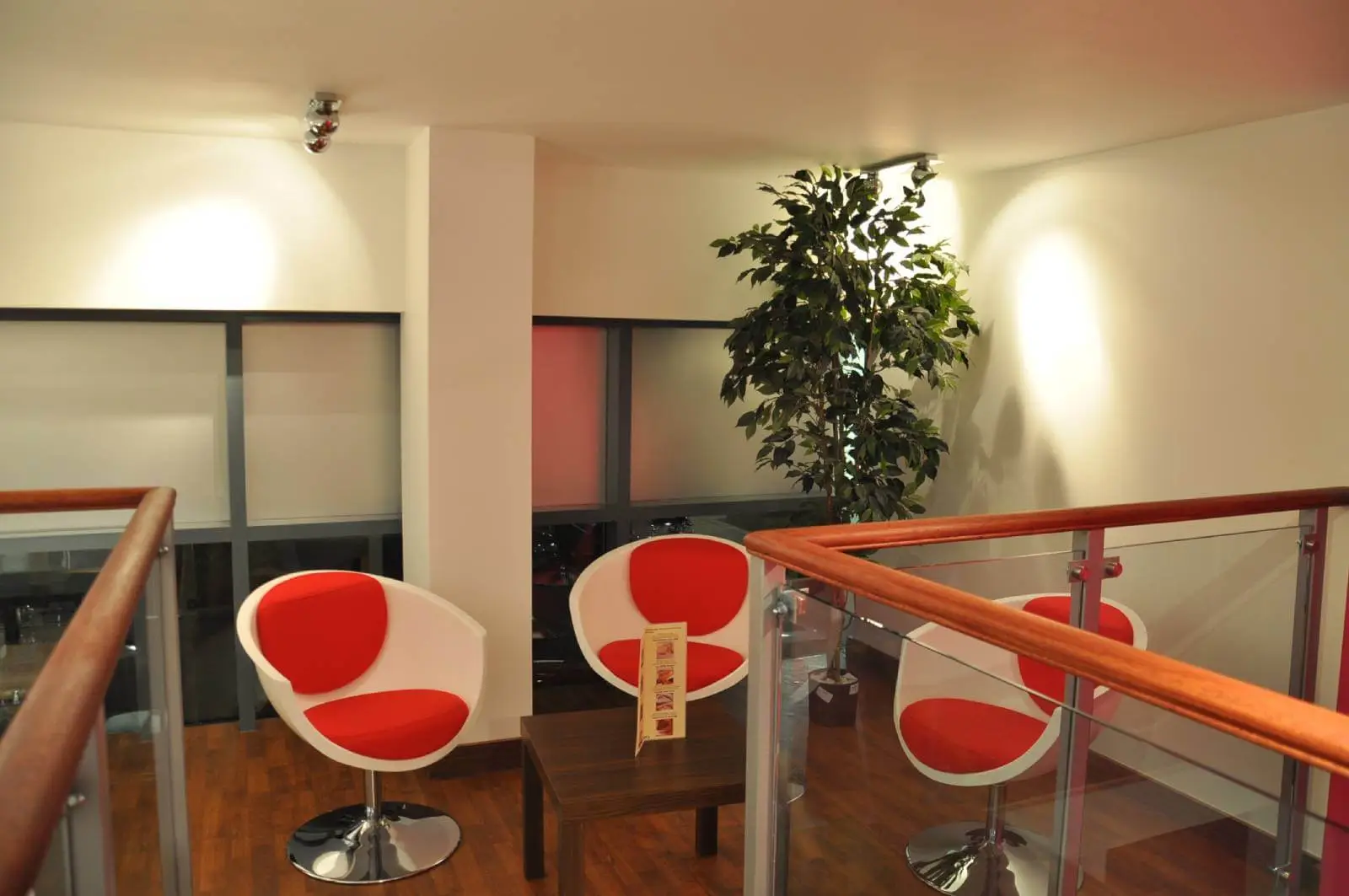 Vanilla Bazaar office space with designer furniture, laminated wood flooring, ceiling and glass partitions 15