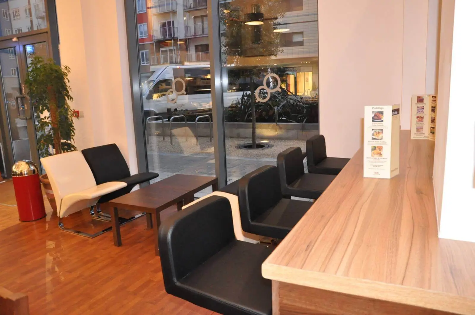 Vanilla Bazaar office space with designer furniture, laminated wood flooring, ceiling and glass partitions 22